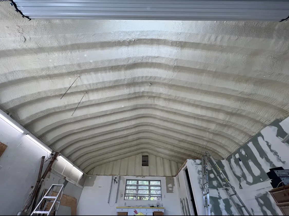 Spray polyurethane foam applied to the underside of a metal roof deck in Orange Cove